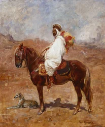 Un Arabe à cheval dans un paysage désertique