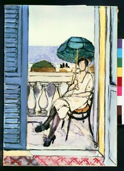 Femme avec un parasol vert sur un balcon