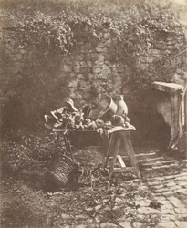 Nature morte - Chaudron, cruche et légumes sur une table à tréteaux