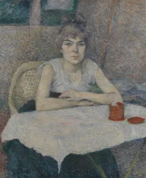Jeune femme à une table