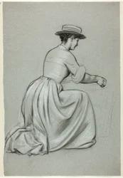 Femme agenouillée avec un chapeau de paille