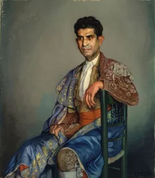Torero en costume de lumières assis sur une chaise