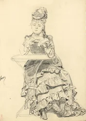 Femme assise à une table de café