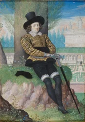 Jeune homme assis sous un arbre