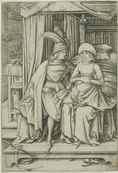 Un homme et une femme assis sur un lit