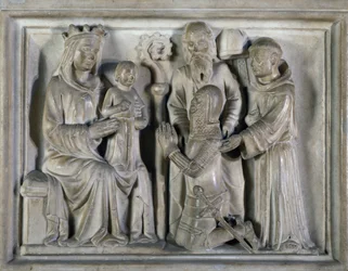 Madone et Enfant, avec un guerrier et des saints, relief créé par Les Maîtres de Campione. Italie