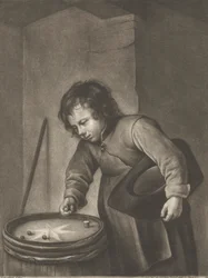 Garçon jouant aux billes