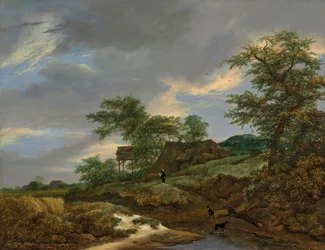 Paysage de dunes avec une maison et un pigeonnier