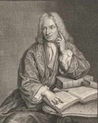 Portrait de Hendrik Snakenburg assis à une table avec quelques livres