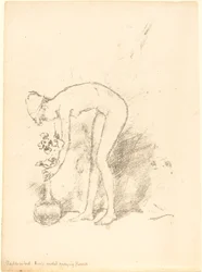 Un modèle nu arrangeant des fleurs