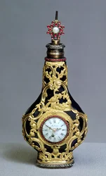 Flacon à parfum avec montre et boussole