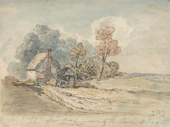 Un cottage au toit de chaume et des arbres au tournant d