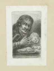 Homme et enfant à la table à manger