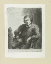 Homme assis à côté d