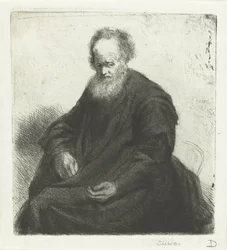 Vieil homme assis avec un long manteau
