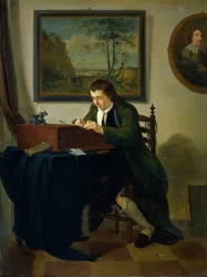Un homme écrivant à son bureau
