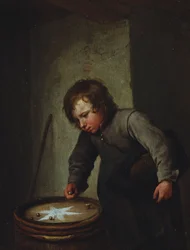 Garçon jouant aux billes