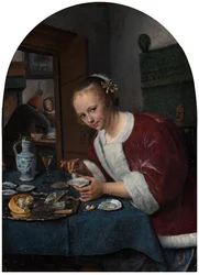 Fille mangeant des huîtres