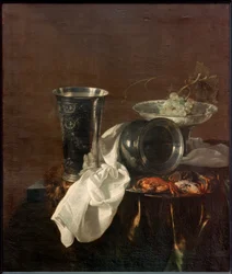 Nature morte de banquet avec une coupe en argent, cruche renversée