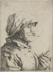 Vieille femme fumant une pipe