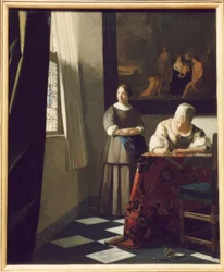 Femme écrivant une lettre avec sa servante