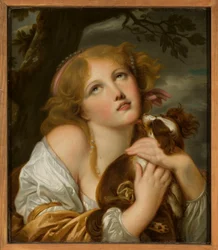 Jeune fille avec un chien dans les bras