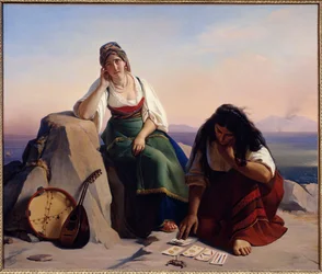 Sorcier tirant les cartes à une fille d