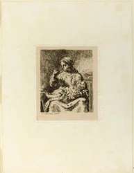 Femme nourrissant son enfant