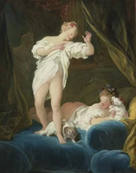 Deux filles sur un lit jouant avec leurs chiens