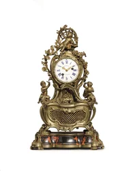 Pendule musicale Louis XV en bronze doré