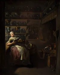 Intérieur de cuisine avec une fille lisant