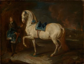Écuyer avec un cheval blanc
