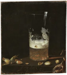 Nature morte avec verre de bière et noix