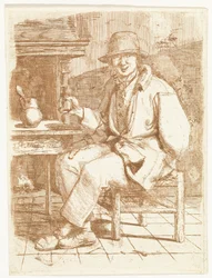 Homme riant avec un verre à la main