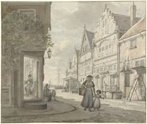 Femme et enfant marchant dans une rue d