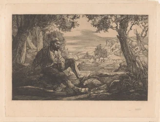 Homme assis dans un paysage vallonné