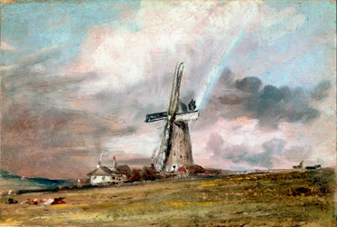 Moulin à vent, maisons et arc-en-ciel