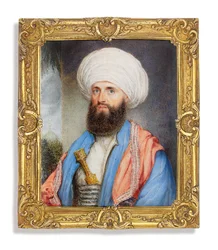 James Silk Buckingham (1786-1855), en chemise blanche avec un manteau bleu clair, châle brodé rose autour des épaules et turban blanc avec un poignard fixé dans son ceinturon, fond de paysage avec une mosquée