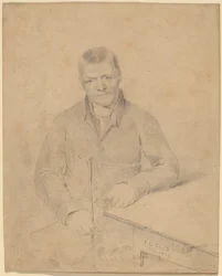 Homme assis à une table