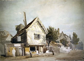 Une rue avec de vieilles maisons, un moulin à vent au-delà