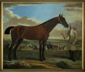Scarr, un cheval de course bai tenu par son entraîneur, A. Scottman