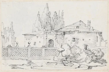 Maison et arbres à travers un mur de jardin