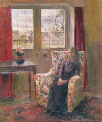 Dans le fauteuil près de la fenêtre