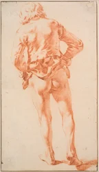 Un homme à moitié nu, marchant, vu de dos