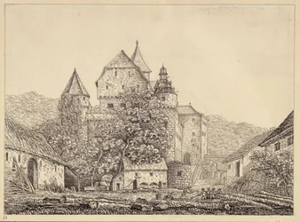 Groupe de bâtiments semblables à un château dans un paysage montagneux