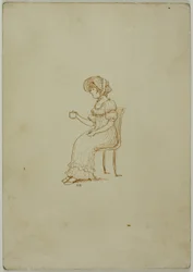 Fille assise tenant une tasse de thé