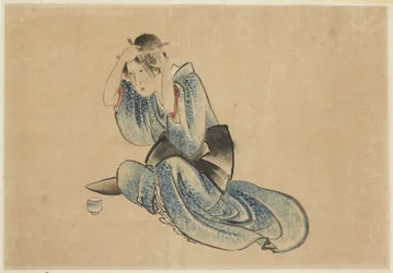 Dame assise à sa toilette
