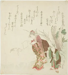 Femme nourrissant une chèvre avec du papier