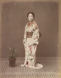 [Femme avec une plante en pot]