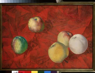 Pommes sur un arriere plan rouge
